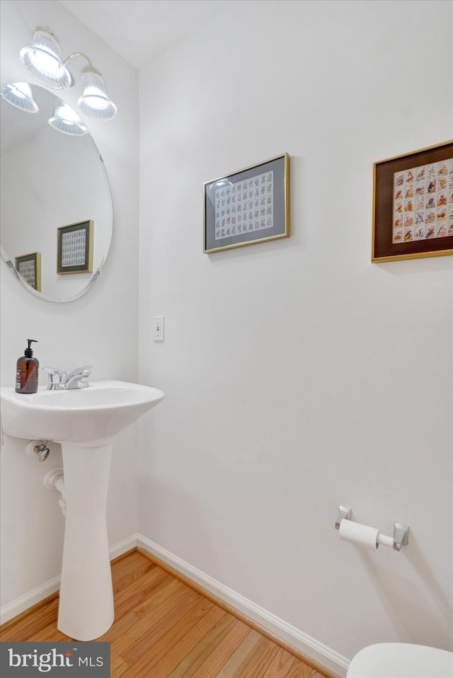 259 Prospect Cir Unit 8, Shrewsbury, PA 17361 - bathroom with wood finished floors, baseboards, and toilet