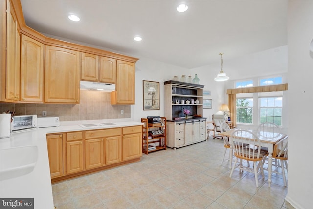 259 Prospect Cir Unit 8, Shrewsbury, PA 17361 - kitchen featuring light brown cabinetry, under cabinet range hood, white electric cooktop, tasteful backsplash, and light countertops