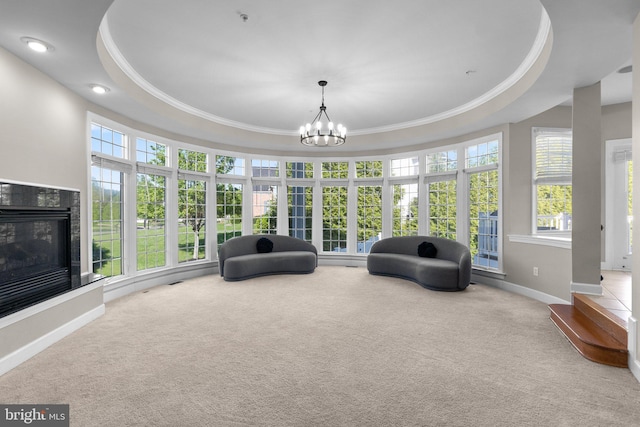 12801 Willow Marsh Ln, Bowie, MD 20720 - sitting room with baseboards, ornamental molding, carpet, a glass covered fireplace, and a tray ceiling