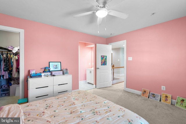 12801 Willow Marsh Ln, Bowie, MD 20720 - carpeted bedroom featuring a walk in closet, a closet, ensuite bathroom, baseboards, and ceiling fan