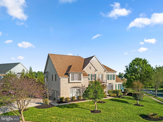 12801 Willow Marsh Ln, Bowie, MD 20720 - view of front of property with brick siding, a front yard, and an attached garage