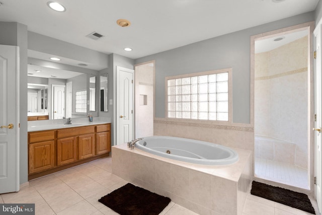 12801 Willow Marsh Ln, Bowie, MD 20720 - full bathroom featuring a tub with jets, vanity, tile patterned flooring, healthy amount of natural light, and recessed lighting