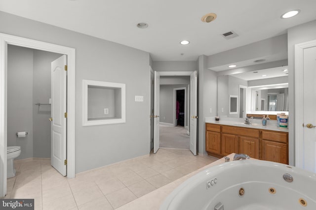 12801 Willow Marsh Ln, Bowie, MD 20720 - full bathroom with toilet, tile patterned floors, vanity, a jetted tub, and baseboards