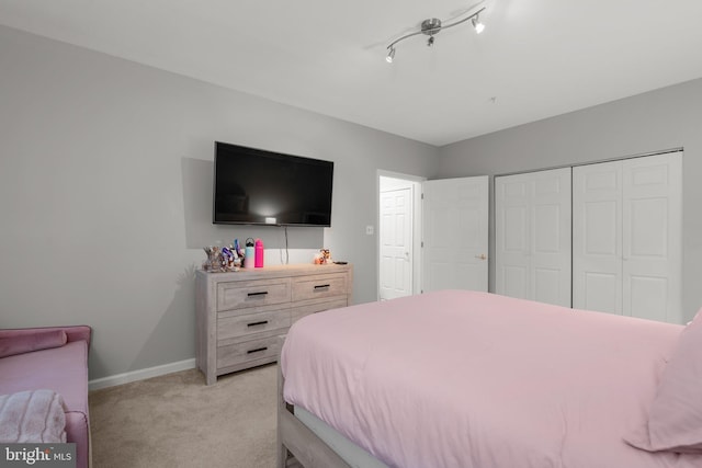 12801 Willow Marsh Ln, Bowie, MD 20720 - bedroom featuring light carpet, a closet, and baseboards