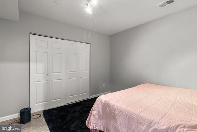 12801 Willow Marsh Ln, Bowie, MD 20720 - bedroom with rail lighting, a closet, and baseboards