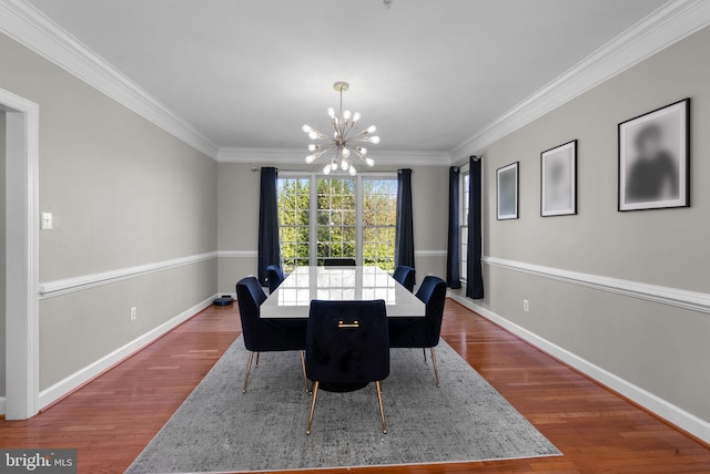 12801 Willow Marsh Ln, Bowie, MD 20720 - dining space featuring a chandelier, wood finished floors, baseboards, and ornamental molding