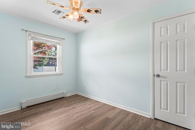 304 Terrace Ave, Toms River, NJ 08753 - unfurnished room featuring baseboard heating, wood finished floors, and baseboards