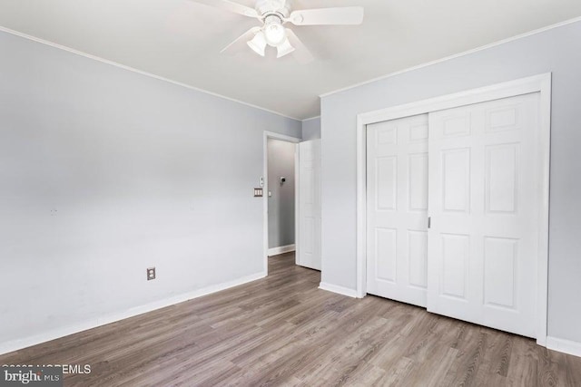 304 Terrace Ave, Toms River, NJ 08753 - unfurnished bedroom with ornamental molding, wood finished floors, a closet, baseboards, and ceiling fan