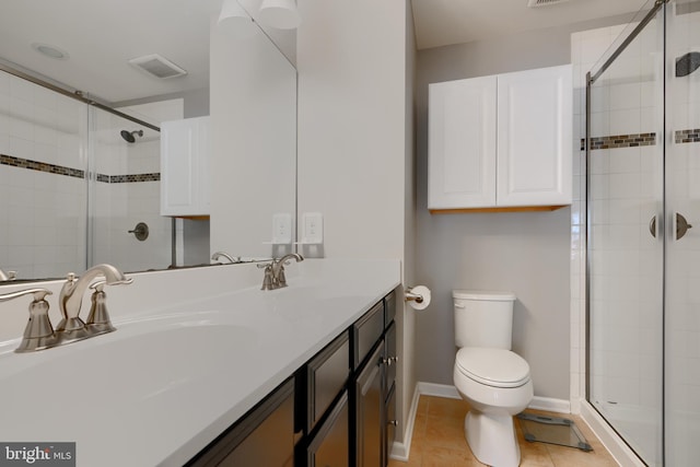 888 S Macon St, Baltimore, MD 21224 - bathroom featuring toilet, a shower stall, double vanity, and baseboards