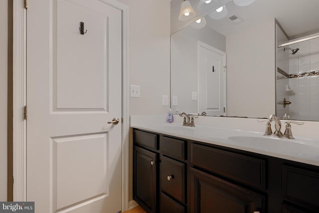 888 S Macon St, Baltimore, MD 21224 - bathroom featuring double vanity and a shower