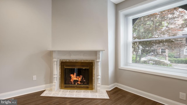 7804 Ardleigh St, Philadelphia, PA 19118 - detailed view of wood finished floors, a fireplace with flush hearth, and baseboards