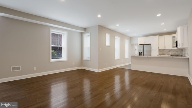 7804 Ardleigh St, Philadelphia, PA 19118 - unfurnished living room with dark wood-style flooring, recessed lighting, and baseboards