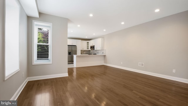 7804 Ardleigh St, Philadelphia, PA 19118 - unfurnished living room featuring dark wood-type flooring, baseboards, and recessed lighting