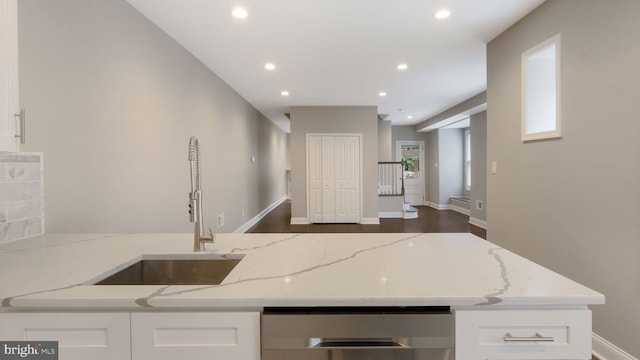 7804 Ardleigh St, Philadelphia, PA 19118 - kitchen featuring dishwasher, light stone counters, a sink, white cabinets, and recessed lighting