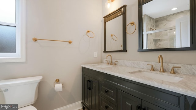 7804 Ardleigh St, Philadelphia, PA 19118 - full bathroom with double vanity, toilet, tiled shower, and baseboards