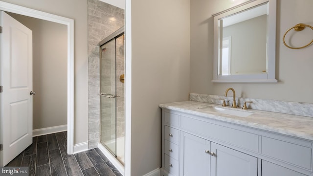 7804 Ardleigh St, Philadelphia, PA 19118 - full bath with a stall shower, vanity, baseboards, and wood finish floors