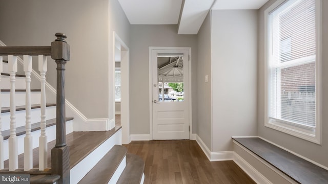 7804 Ardleigh St, Philadelphia, PA 19118 - entrance foyer with dark wood-type flooring, plenty of natural light, stairway, and baseboards