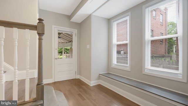 7804 Ardleigh St, Philadelphia, PA 19118 - foyer entrance with light wood-style floors, baseboards, and stairs