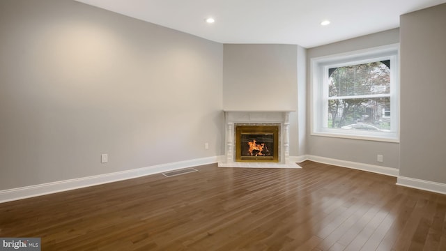 7804 Ardleigh St, Philadelphia, PA 19118 - unfurnished living room with a fireplace with flush hearth, dark wood finished floors, baseboards, and recessed lighting