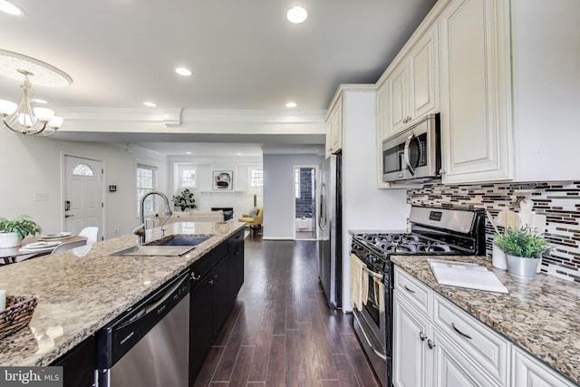 3404 Shepherd St, Mount Rainier, MD 20712 - kitchen with appliances with stainless steel finishes, a sink, crown molding, tasteful backsplash, and white cabinetry