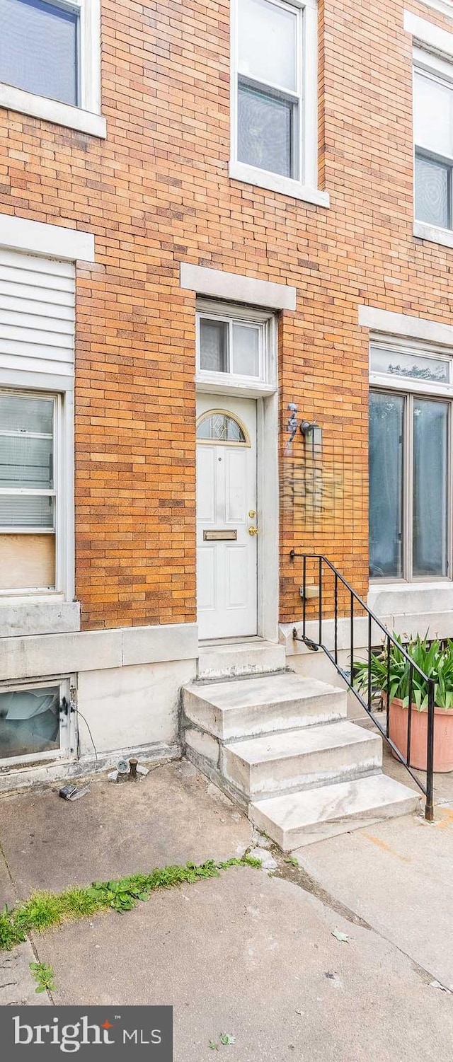 2715 E Madison St, Baltimore, MD 21205 - property entrance featuring brick siding