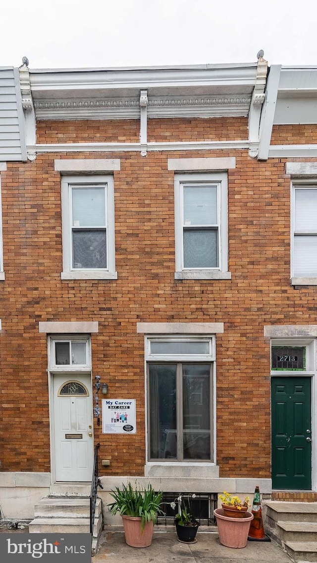2715 E Madison St, Baltimore, MD 21205 - view of front facade featuring brick siding and entry steps
