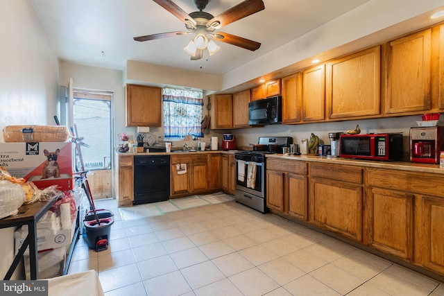 2715 E Madison St, Baltimore, MD 21205 - kitchen featuring black appliances, brown cabinetry, ceiling fan, light tile patterned floors, and a sink