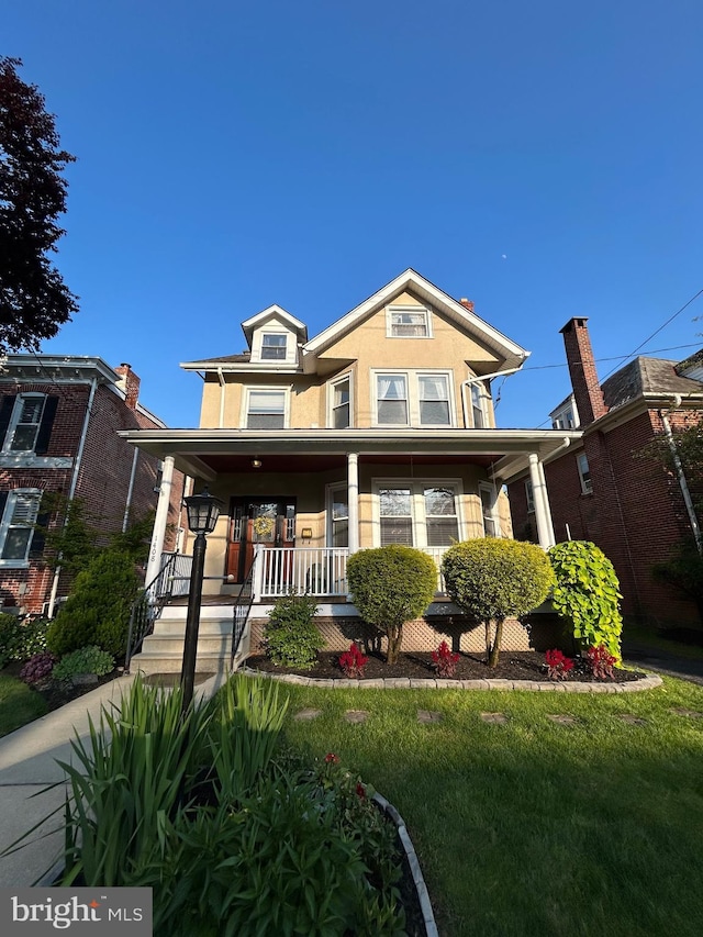 1408 Riverview Ave, Wilmington, DE 19806 - view of front of property with covered porch and stucco siding