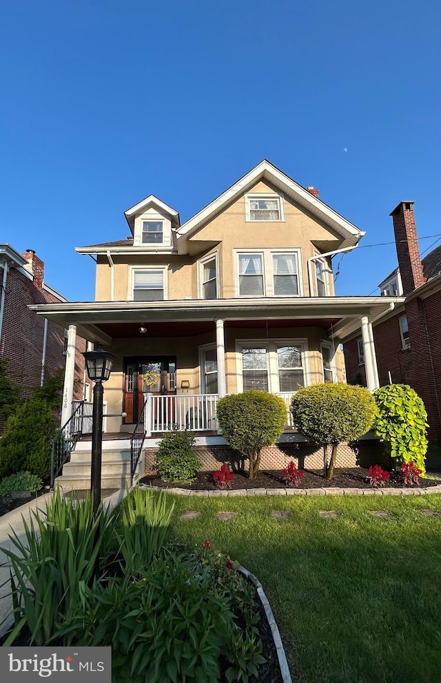 1408 Riverview Ave, Wilmington, DE 19806 - view of front facade with covered porch and stucco siding