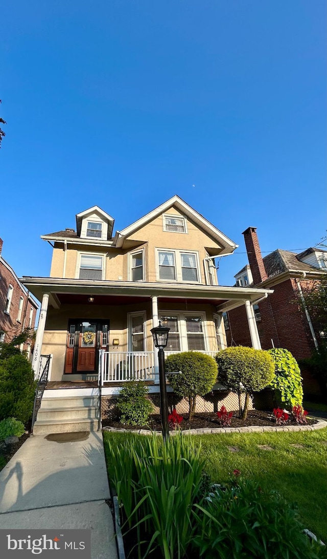 1408 Riverview Ave, Wilmington, DE 19806 - view of front of property with stucco siding and covered porch