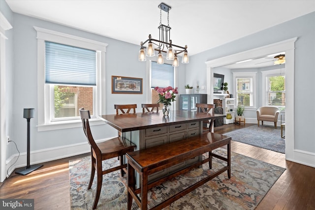 1408 Riverview Ave, Wilmington, DE 19806 - dining room with wood finished floors, baseboards, a chandelier, and ceiling fan
