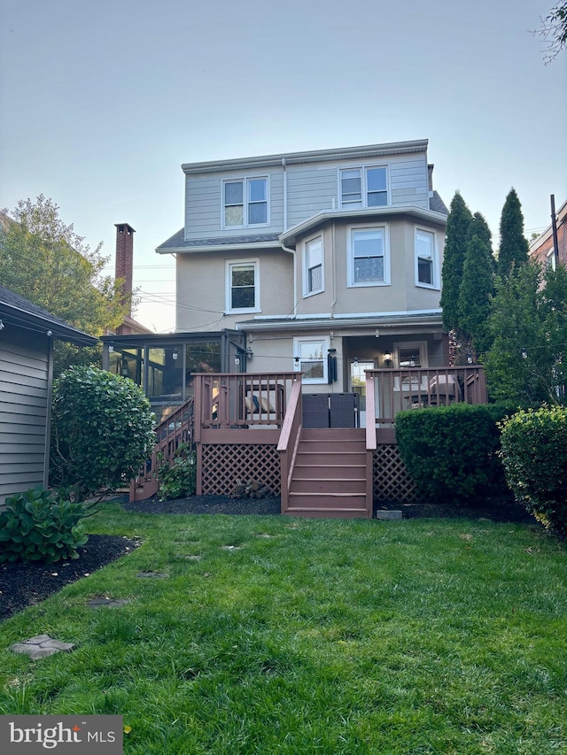 1408 Riverview Ave, Wilmington, DE 19806 - rear view of house featuring stairs, a deck, stucco siding, and a yard