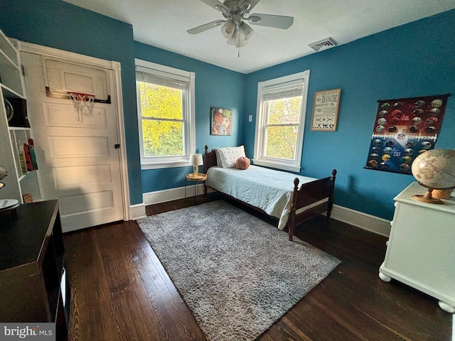1408 Riverview Ave, Wilmington, DE 19806 - bedroom featuring baseboards, multiple windows, and dark wood-style floors