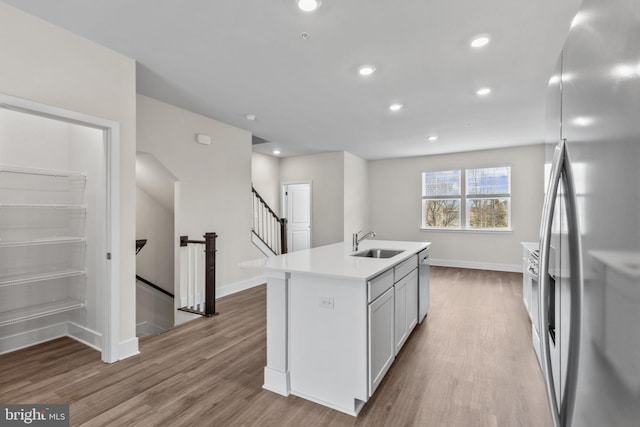 10604 Meridian Hill Way, Upper Marlboro, MD 20772 - kitchen featuring stainless steel appliances, a sink, wood finished floors, light countertops, and recessed lighting
