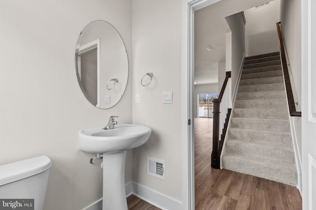 10604 Meridian Hill Way, Upper Marlboro, MD 20772 - bathroom with toilet, baseboards, and wood finished floors