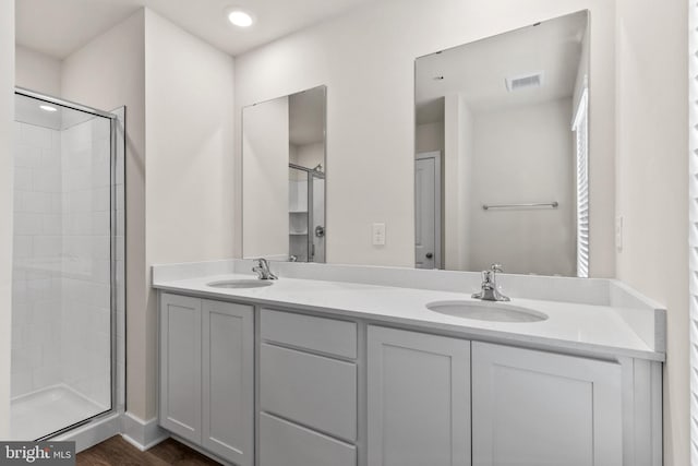 10604 Meridian Hill Way, Upper Marlboro, MD 20772 - bathroom with double vanity, a shower stall, and wood finished floors