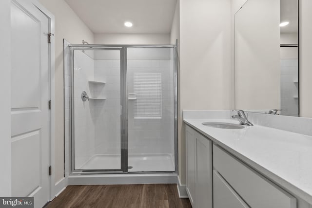 10604 Meridian Hill Way, Upper Marlboro, MD 20772 - full bathroom featuring a shower stall, wood finished floors, vanity, and recessed lighting