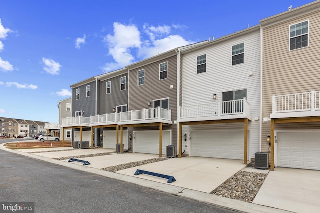 10604 Meridian Hill Way, Upper Marlboro, MD 20772 - back of property with concrete driveway, a garage, central AC, and a residential view