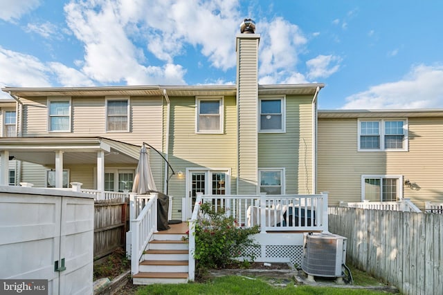 10 Bantry Ct, Baltimore, MD 21237 - rear view of house featuring central AC unit, a chimney, and a deck
