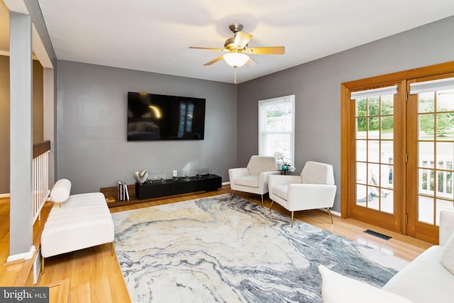 10 Bantry Ct, Baltimore, MD 21237 - living room with plenty of natural light, a ceiling fan, and wood finished floors