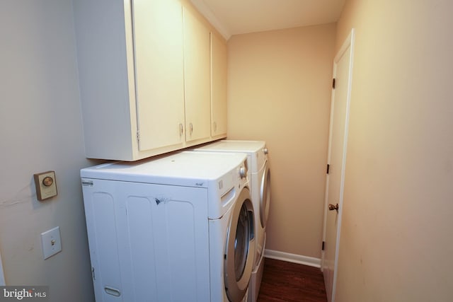 1206 Orchard Cir, Salisbury, MD 21801 - laundry area featuring cabinet space, dark wood-style flooring, washing machine and dryer, and baseboards