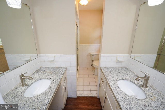 1206 Orchard Cir, Salisbury, MD 21801 - full bathroom with tile walls, toilet, a wainscoted wall, vanity, and an enclosed shower