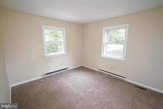 1206 Orchard Cir, Salisbury, MD 21801 - empty room with baseboard heating, healthy amount of natural light, a baseboard radiator, and carpet floors