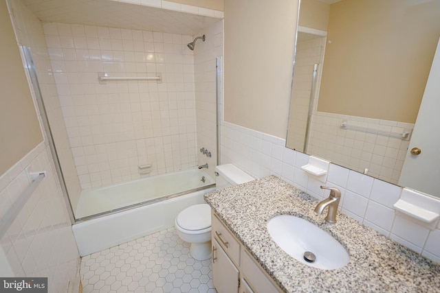 1206 Orchard Cir, Salisbury, MD 21801 - full bathroom featuring toilet, tile walls, enclosed tub / shower combo, vanity, and a wainscoted wall