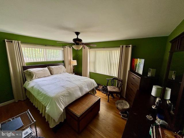 4116 Ellis St, Capitol Heights, MD 20743 - bedroom with wood finished floors and a ceiling fan
