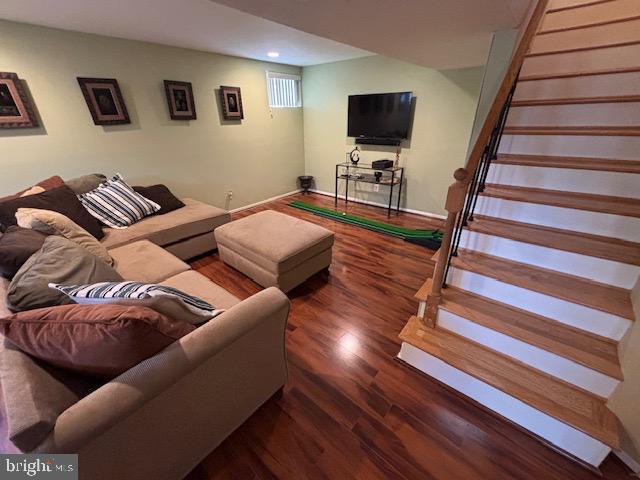 4116 Ellis St, Capitol Heights, MD 20743 - living area with stairway, wood finished floors, recessed lighting, and baseboards