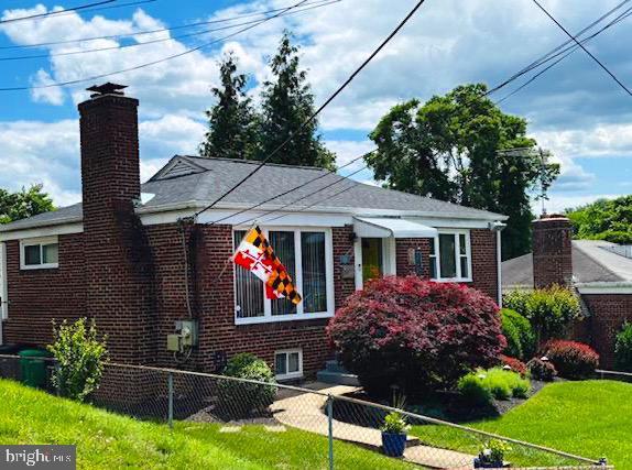 4116 Ellis St, Capitol Heights, MD 20743 - bungalow-style home featuring brick siding and a chimney