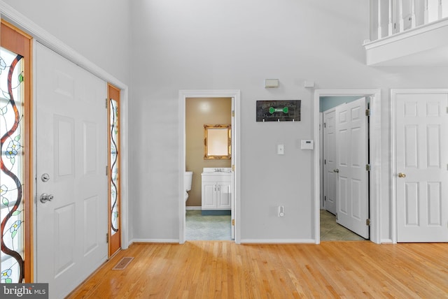 53 Pebble Beach Ln, Pottstown, PA 19464 - entryway featuring light wood-style floors, baseboards, and a high ceiling