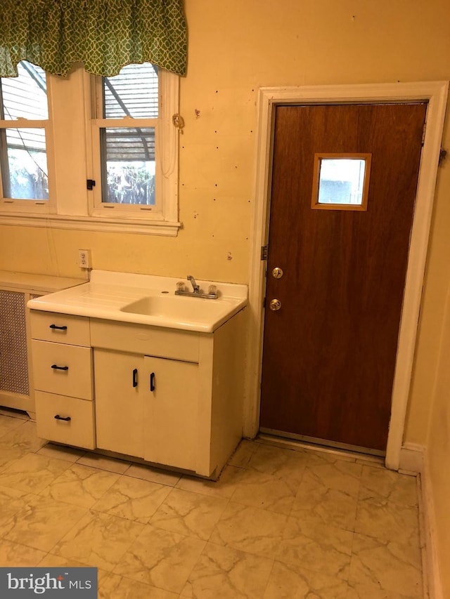 2312 Memphis St, Philadelphia, PA 19125 - bathroom featuring marble look tiles, vanity, and plenty of natural light