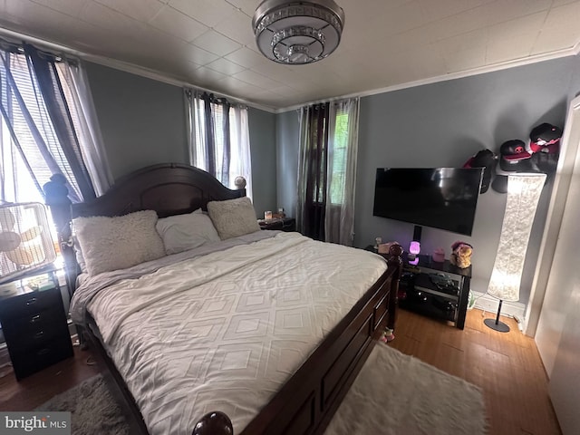 202 N Penn St, York, PA 17401 - bedroom featuring wood finished floors and ornamental molding